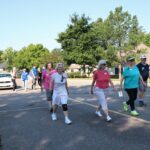 Seniors walking in the streets at Lakewood Retirement Community for Summer Games Event
