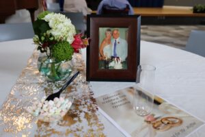 Close up on arrangements on a guest table during resident wedding renewals