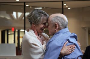 A senior couple dance together after their vow renewal.