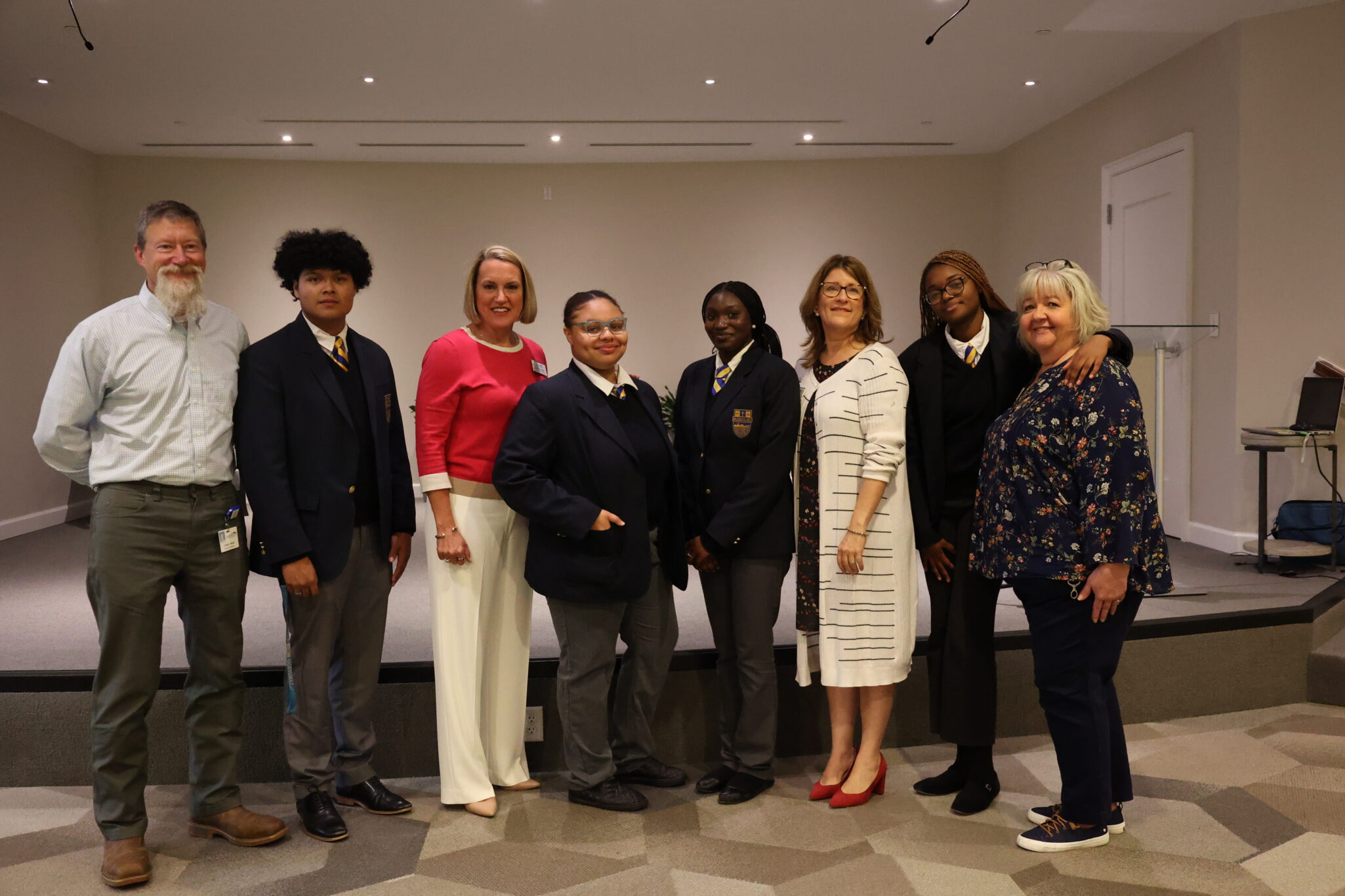 Four students from Cristo Rey Richmond High School recently completed a 10-month corporate work-study program at Lakewood. The program offers a unique opportunity for young people to acquire valuable skills and experience in a professional work environment. The students post for a photo with staff at Lakewood.