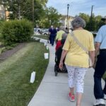 Seniors walking on outdoor path