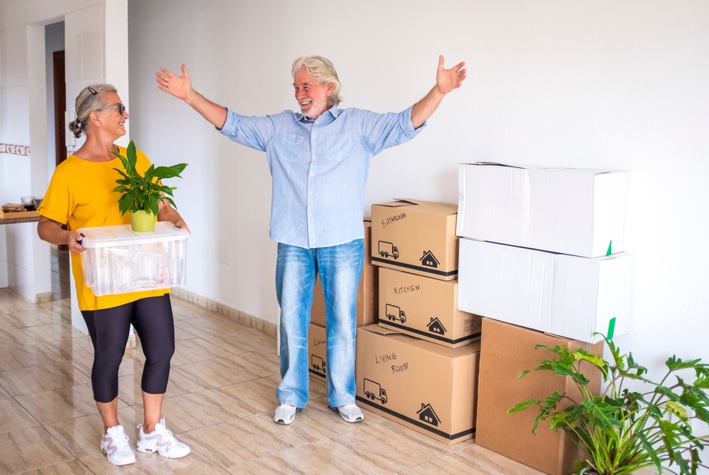 Senior couple in new, spacious apartment