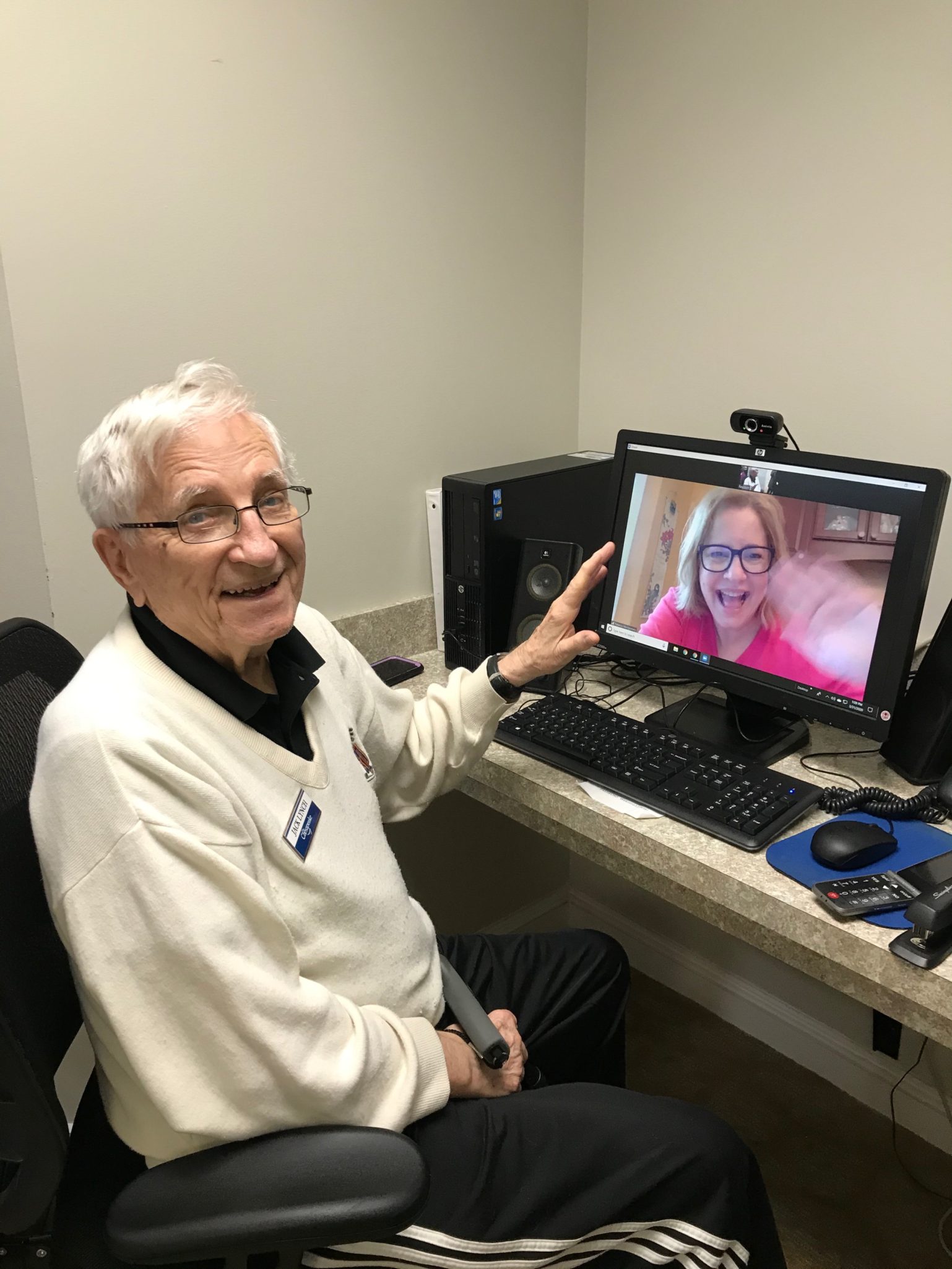 senior on facetime with family