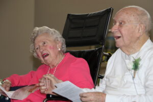 Residents Marianne and John Harris hold hands while renewing their vows.