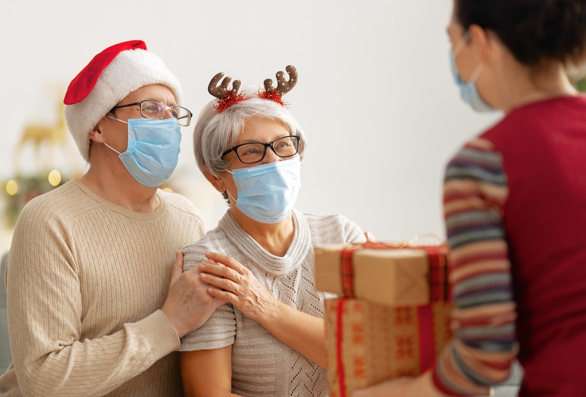 two seniors with christmas accessories on