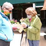 Lakewood Retirement Community friends picking up Farmer Market Produce at Earth Day Celebration