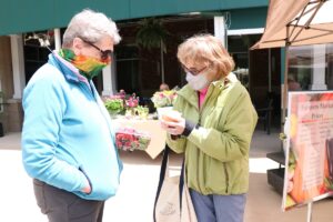 Lakewood Retirement Community friends picking up Farmer Market Produce at Earth Day Celebration