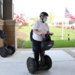 Lakewood Independent Living female residents riding on Segway courtesy of RVA on Wheels.