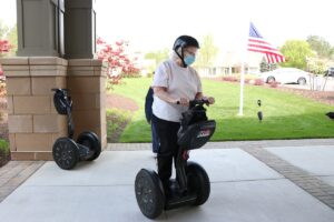 Lakewood Independent Living female residents riding on Segway courtesy of RVA on Wheels.