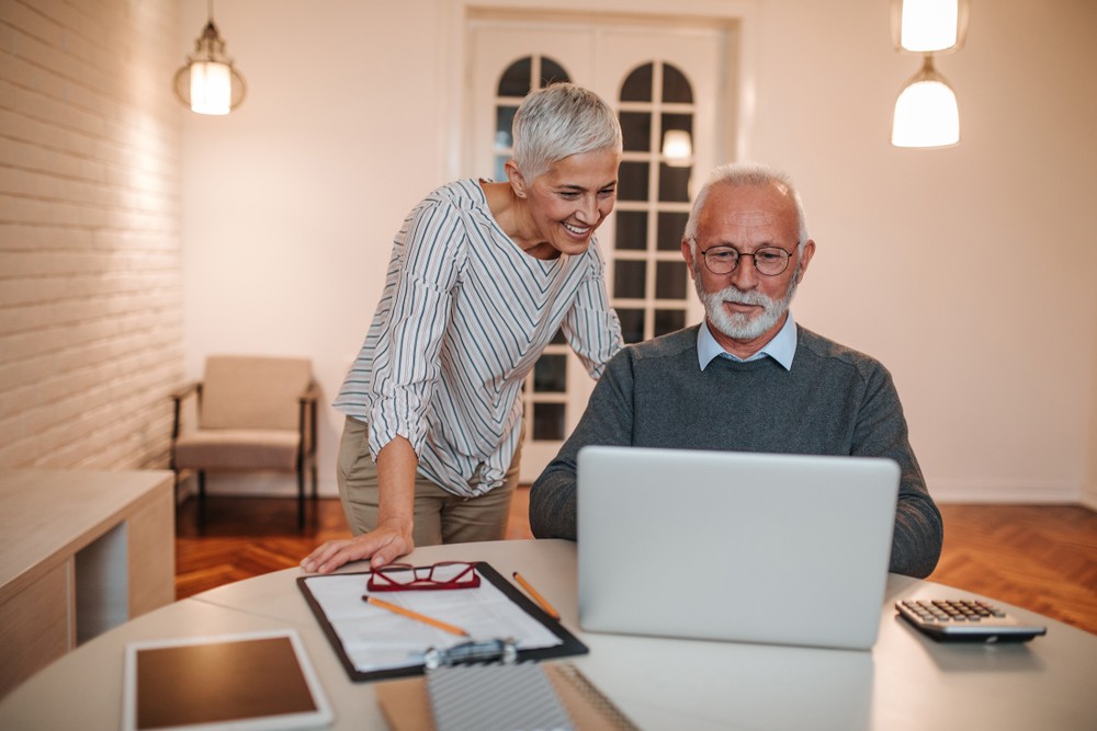 Senior couple researching senior living options