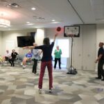 Seniors playing basketball Summer Games Event at Lakewood Senior Living