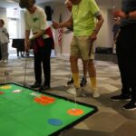 Seniors playing Mini Golf at Lakewood Senior Living
