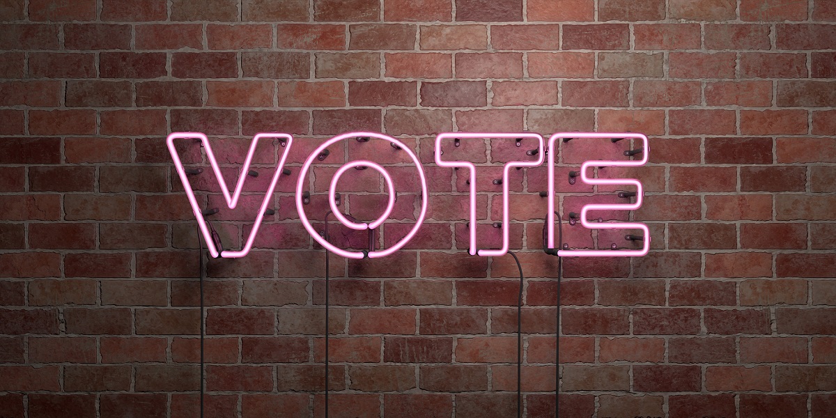 VOTE - fluorescent Neon tube Sign on brickwork