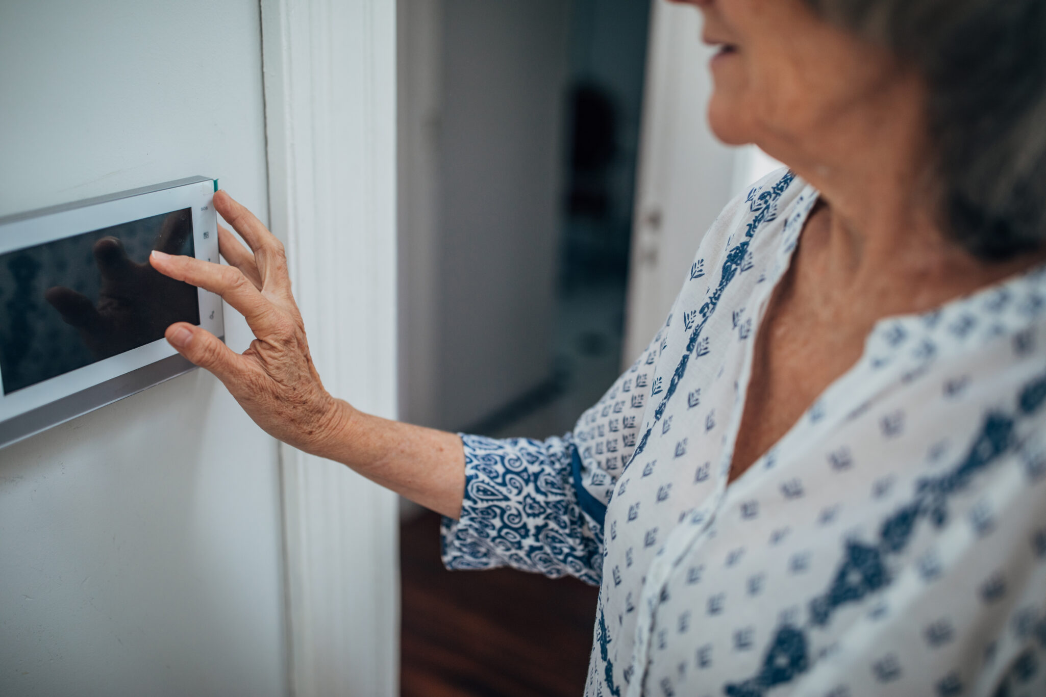 Senior lady using home automation