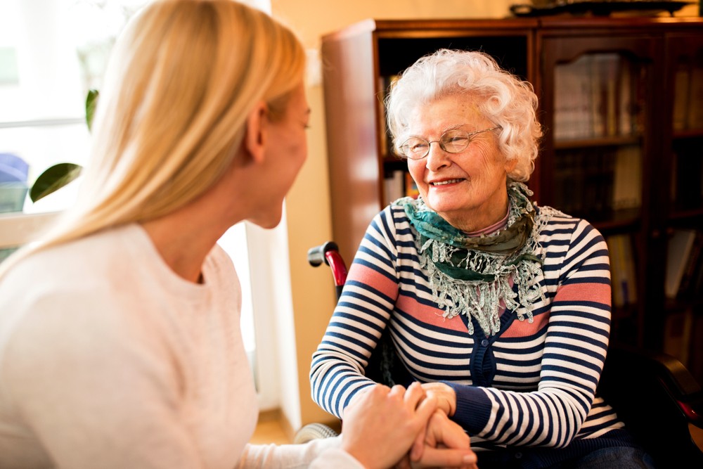 Senior woman talking with adult child