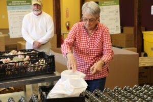Seniors preparing meals on wheels deliveries