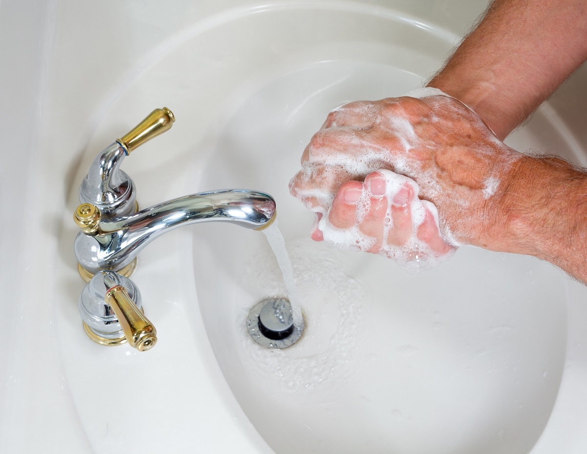 Senior man washing hands