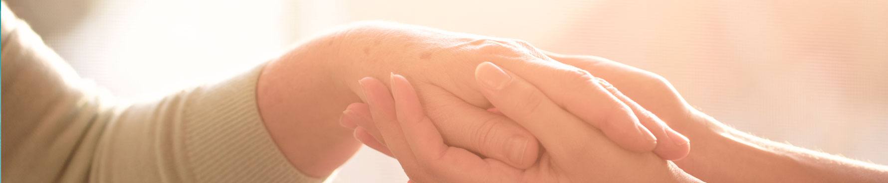 hand holding at Lakewood Senior Living